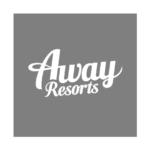 Away Resorts Logo featuring the words Away Resorts in green cursive against a grey background.