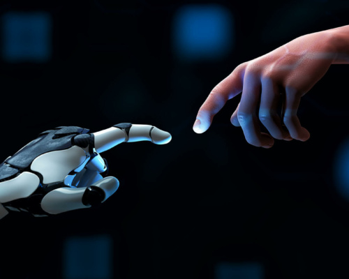 A human hand and a robotic hand reach towards each other with outstretched fingers, nearly touching against a dark background with blue highlights.