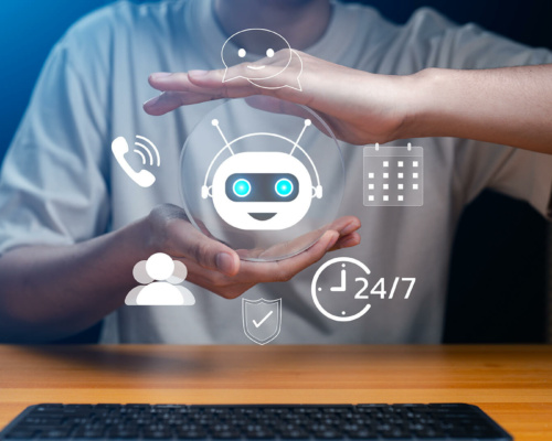 A person cups their hands around a floating robot icon, encircled by digital communication symbols, representing artificial intelligence in answering service versus virtual receptionist solutions.