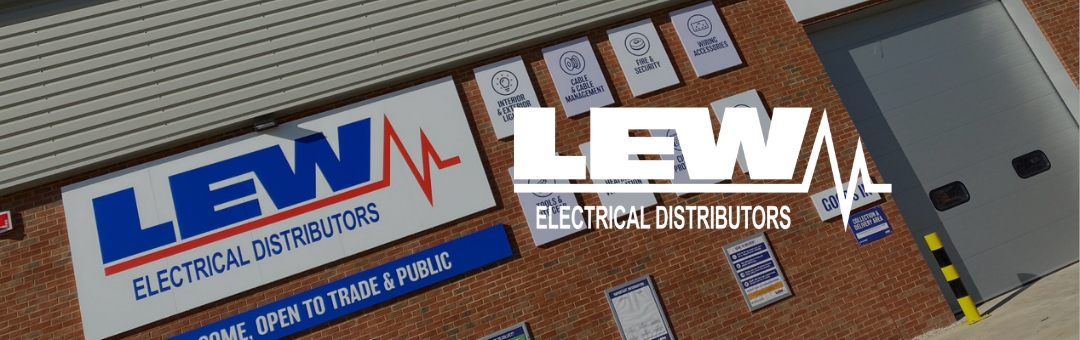 Storefront of LEW Electrical Distributors with signage on a brick building, including a large logo and the words Open to Trade & Public.