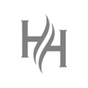 Grey logo featuring two capital letter Hs facing each other, separated by two curved, flame-like lines in the centre, on a white background.