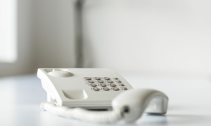 white-landline-telephone-with-handset-off-line