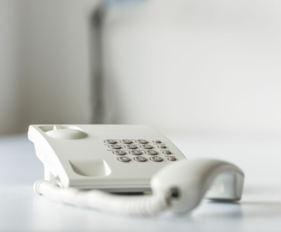 white-landline-telephone-with-handset-off-line