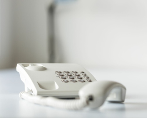 white-landline-telephone-with-handset-off-line