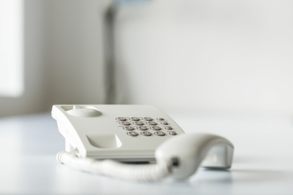 white-landline-telephone-with-handset-off-line